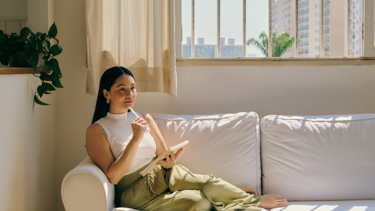 Women on the couch thinking about mindfulness