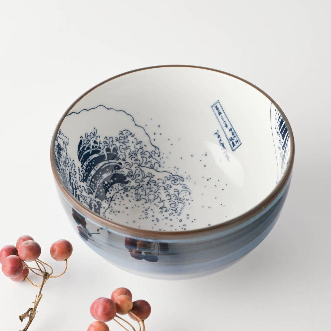Ceramic bowl with blue floral design on a white background