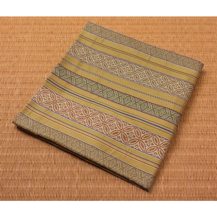 Folded fabric with a pattern on a woven surface