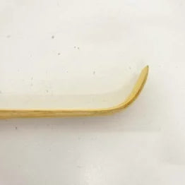 Gold-colored object on a white background