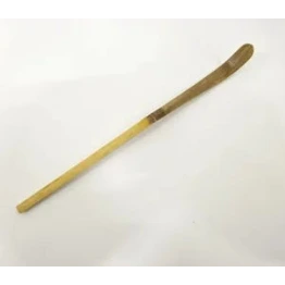 Long wooden tool with a pointed end on a white background