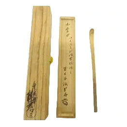 Two wooden boxes with calligraphy on a white background