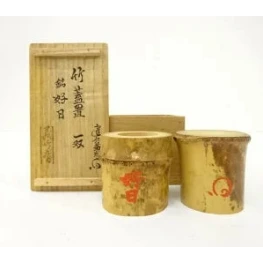 Two wooden containers with a wooden box featuring Japanese text on a white background