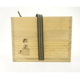 Wooden box with a metal zipper on a white background