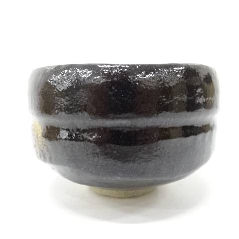 Black ceramic cup on a white background