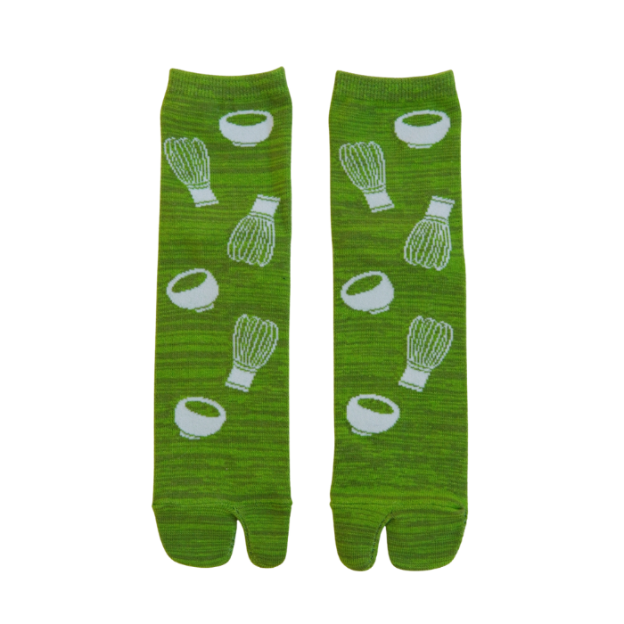 Green socks with white patterns on a white background