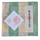 Textile product with a ball of dragon design and text on a checkered background