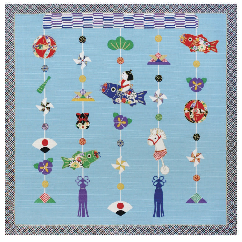 Colorful decorative hanging with various shapes and patterns on a blue background