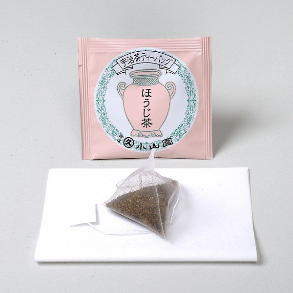 Tea bag packaging with a triangular tea bag on a white background