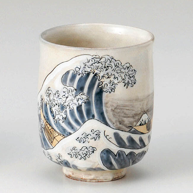 Ceramic cup with wave design on a gray background