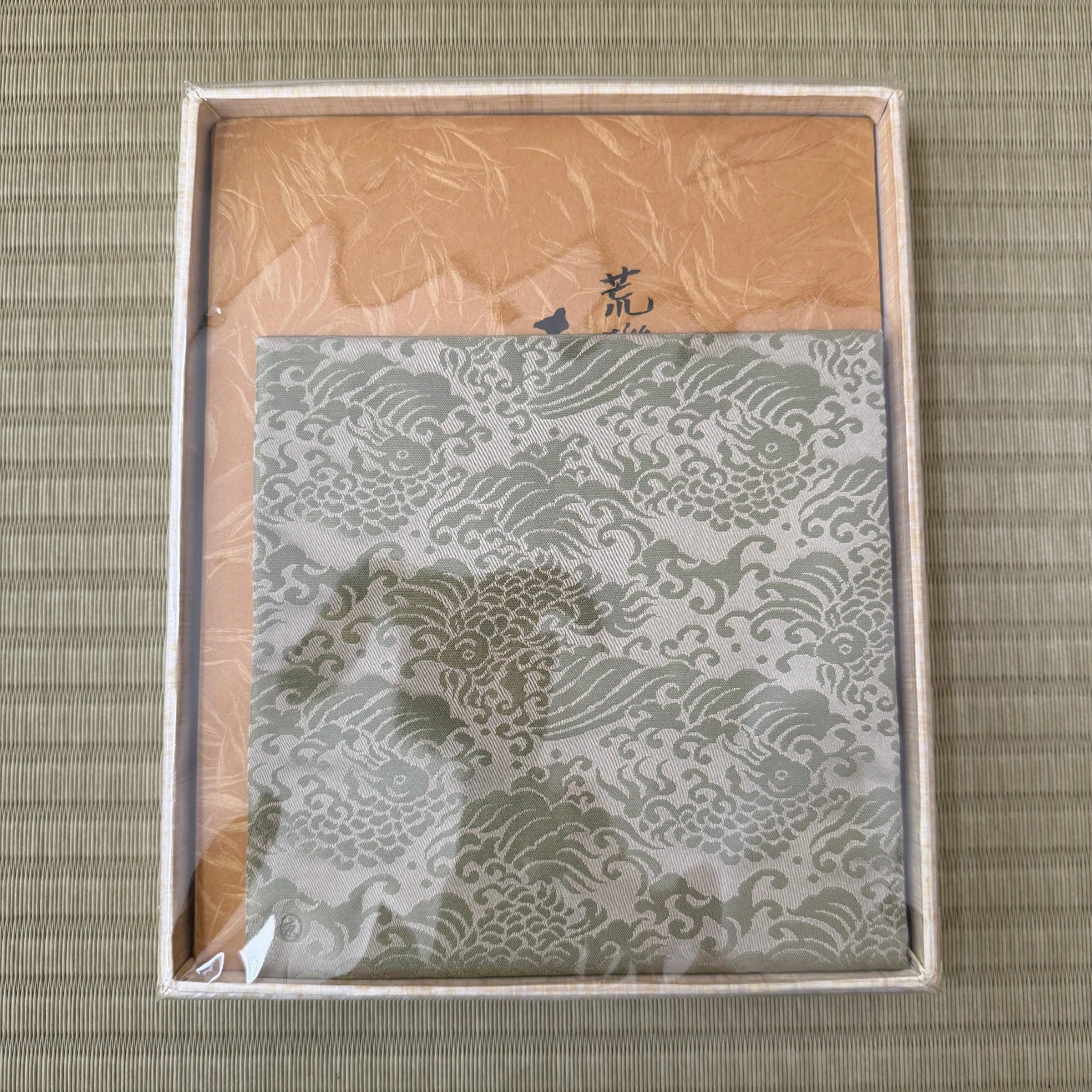 Packaged product with dragon design on a textured surface