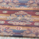 Close-up of patterned fabric with floral design on a grid background