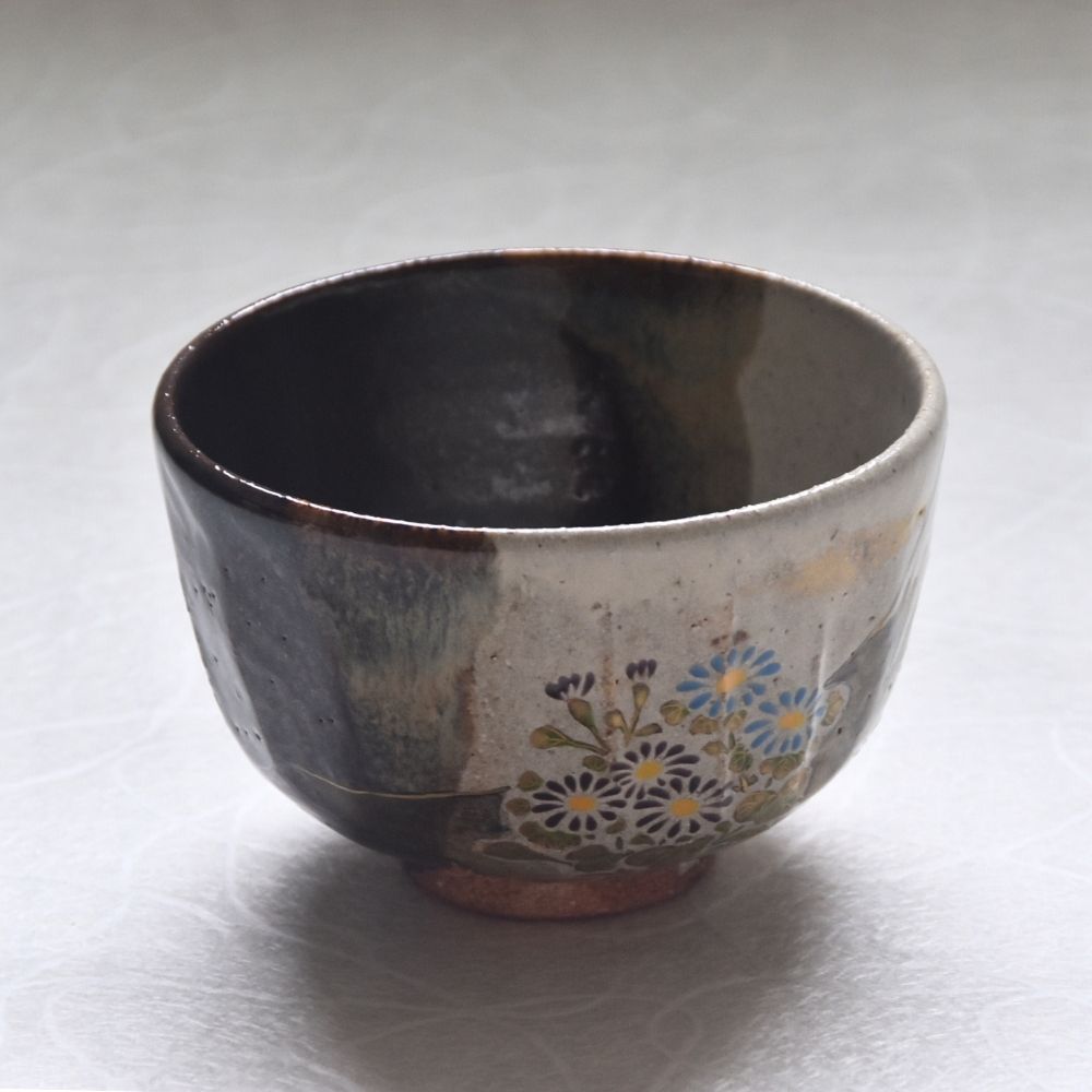 Ceramic bowl with floral patterns on a white background