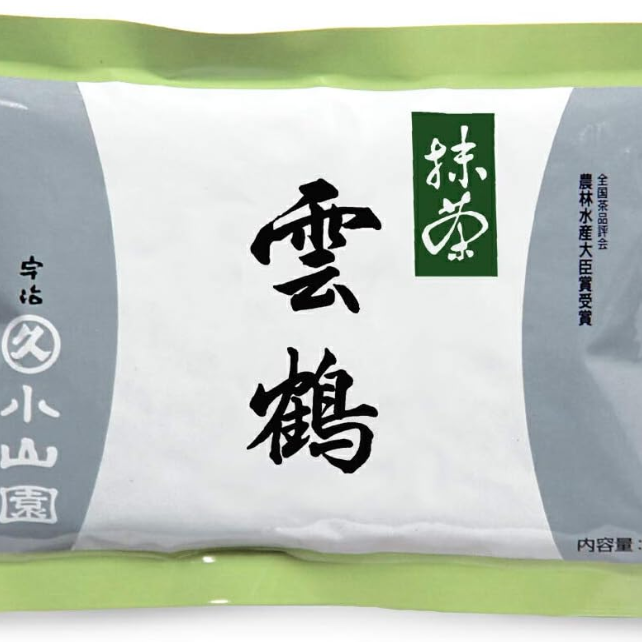 A bag of UNKAKU Ceremonial Grade Matcha by Marukyu Koyamaen with Japanese characters displayed on the label.