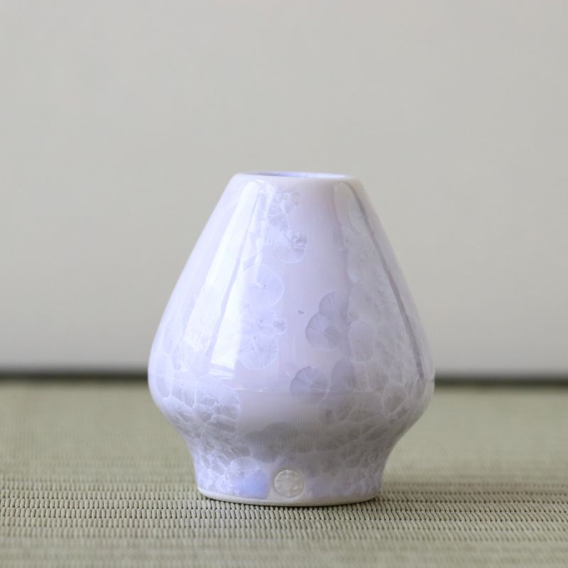 White textured diffuser on a light surface with a neutral background