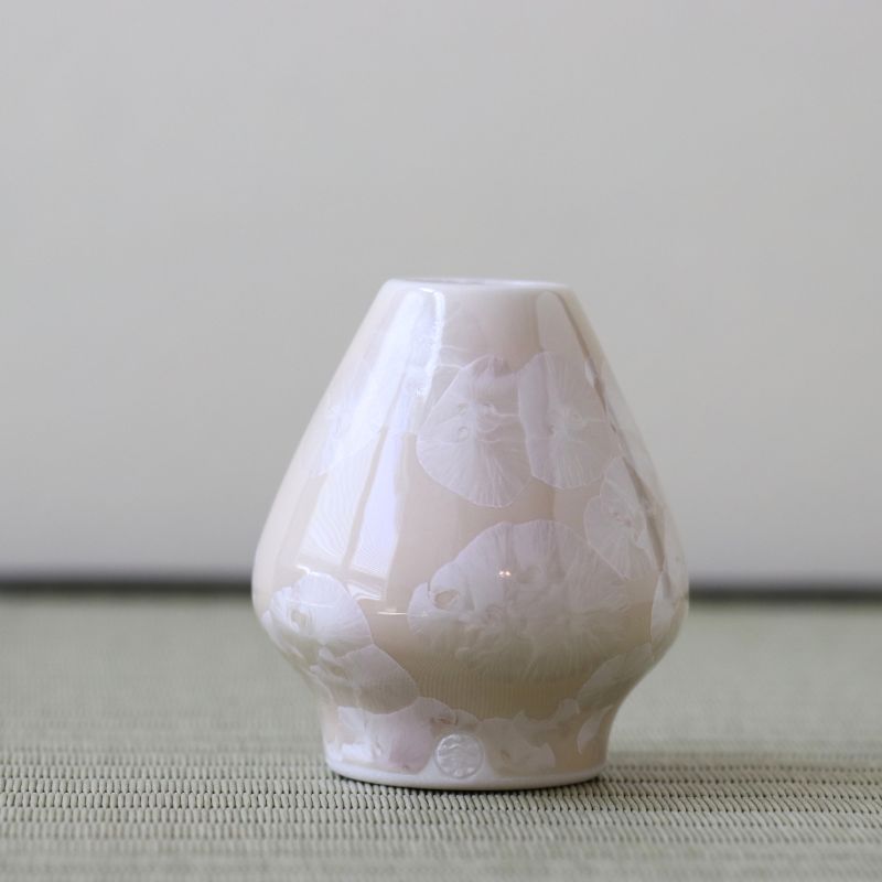 Matcha Wrisk stand holder with floral patterns on a neutral background