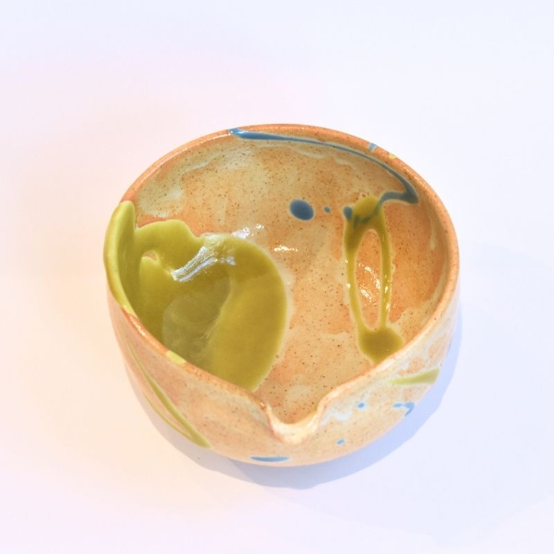 Ceramic bowl with abstract design on a gradient background