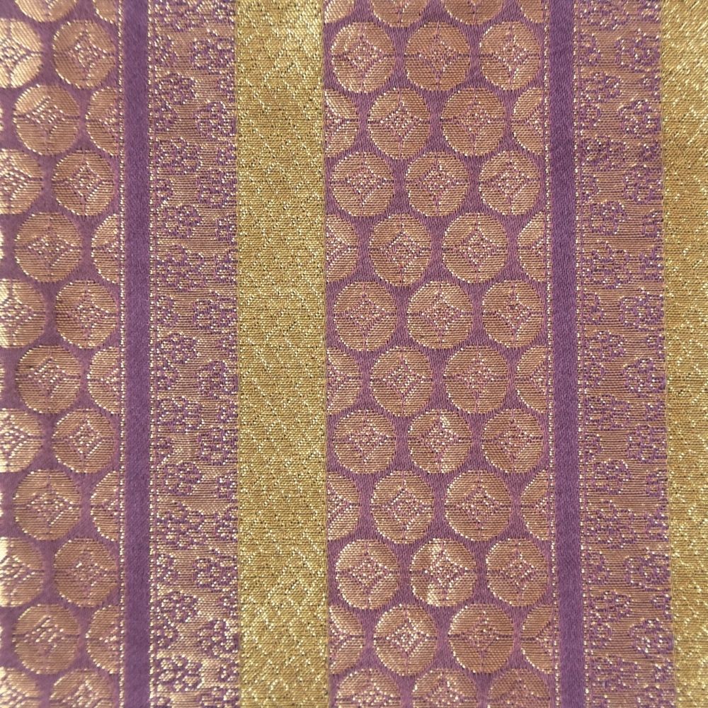 Striped fabric with gold and purple pattern