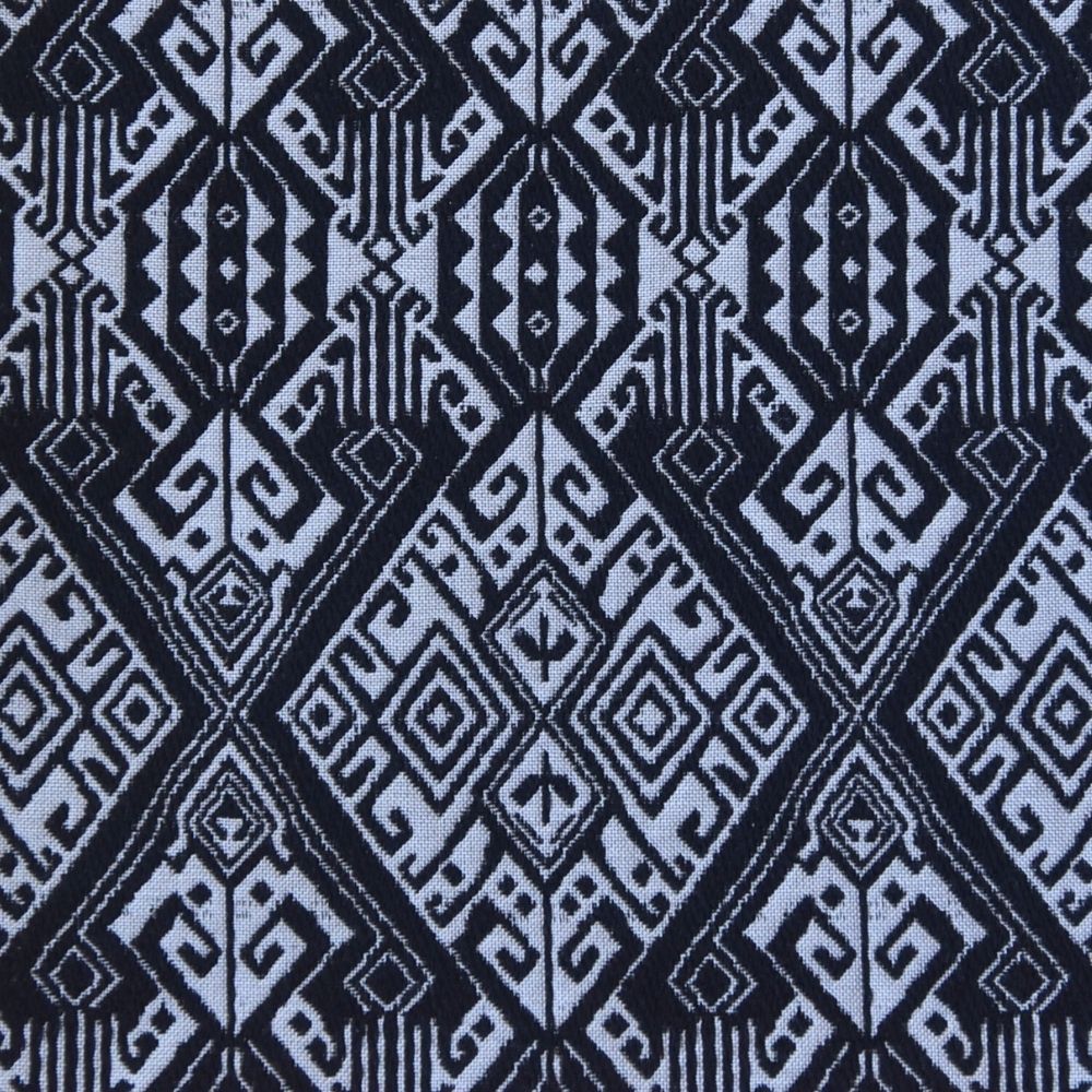 Patterned fabric with geometric design in black and white.