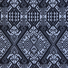 Patterned fabric with geometric design in black and white.
