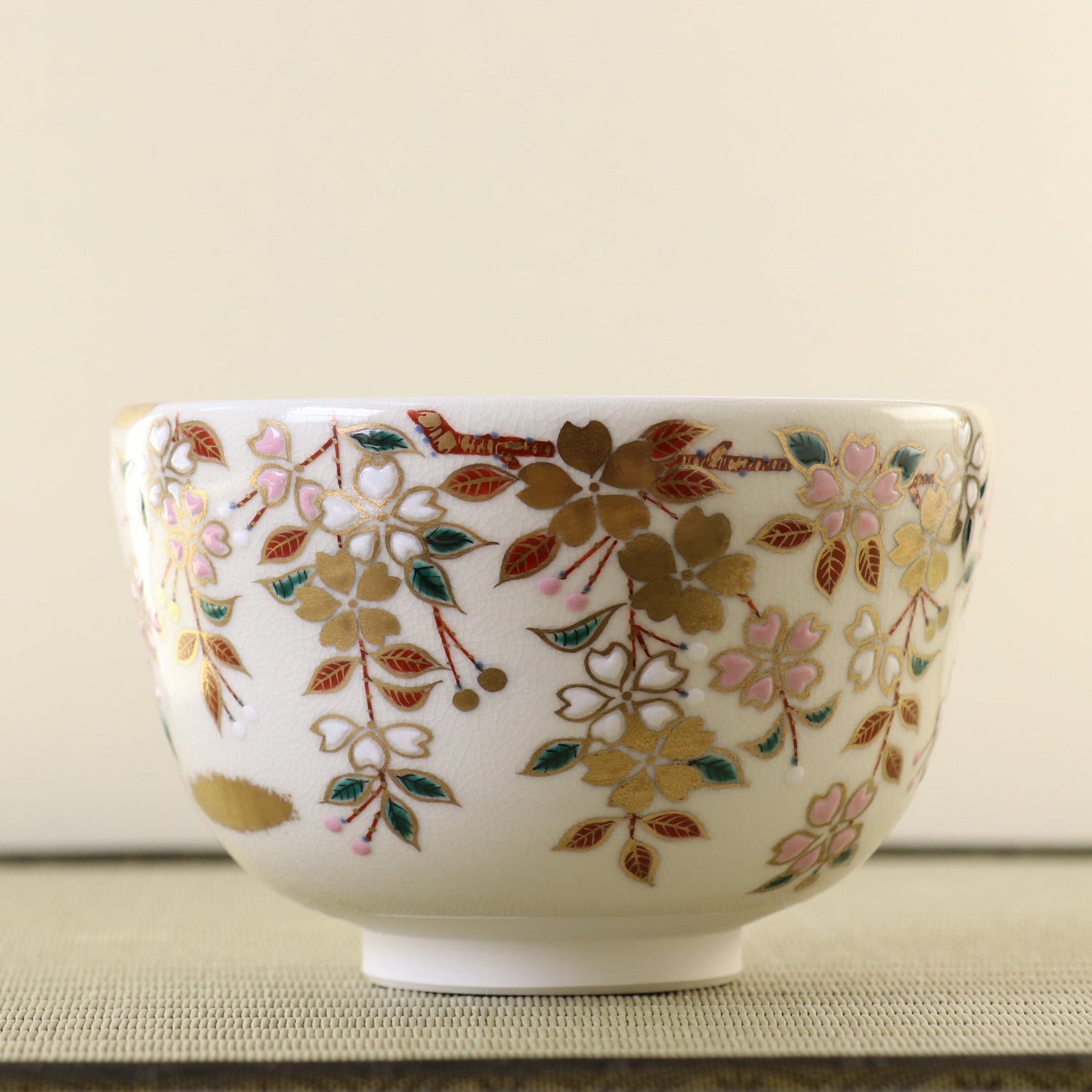 Decorative ceramic bowl with floral patterns on a neutral background