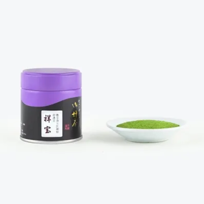 Container of green powder with a purple lid on a white background
