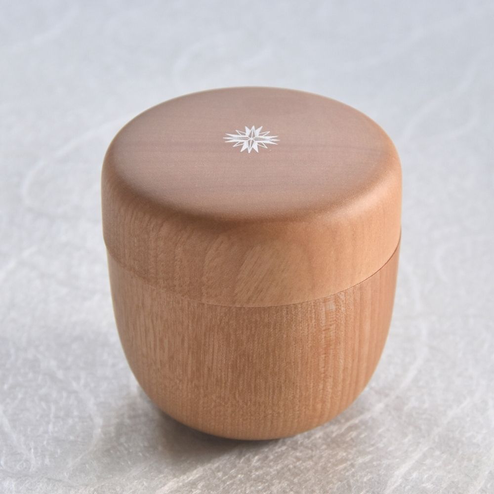 Wooden container with a snowflake design on a white background