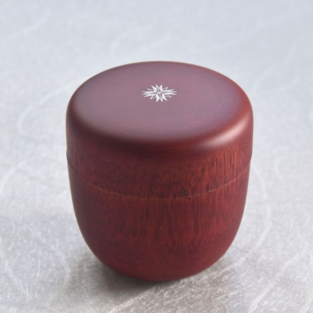 Wooden container with a snowflake design on a white background