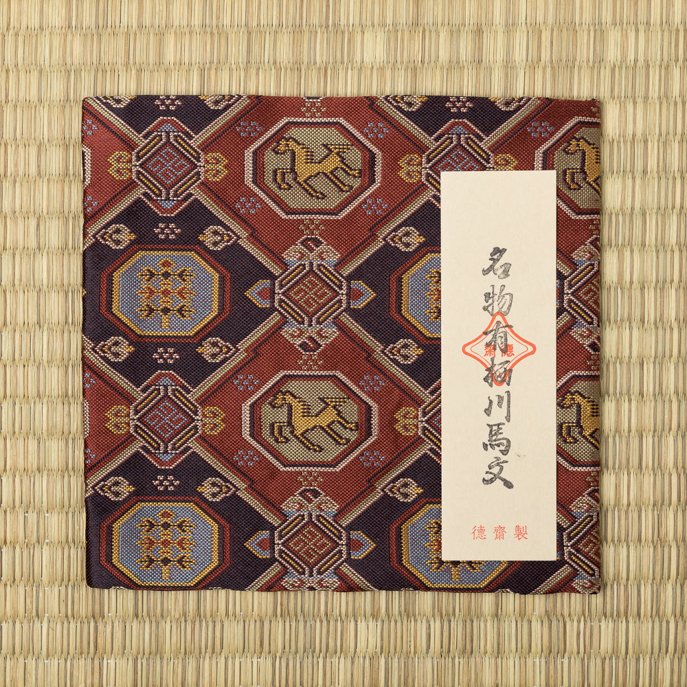 Arisugawa Uma Mon Nishijin silk kobukusa displayed on tatami with its Japanese paper title label.