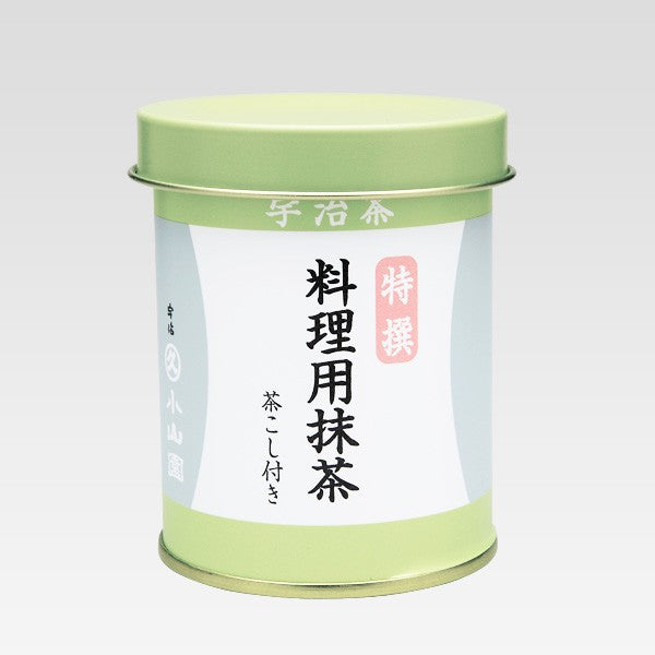 Green tea canister with Japanese text on a light gray background