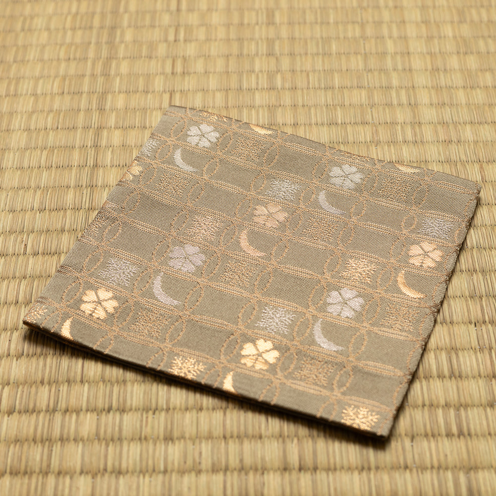 Angled view of the hand-sewn khaki green Chitose-bon kobukusa resting on tatami.