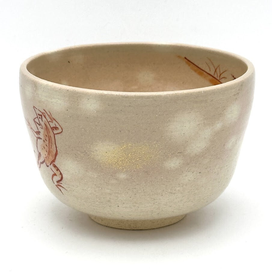 Angled view of the hand-painted Choju-Giga matcha bowl showing the rounded form and frolicking animal motif