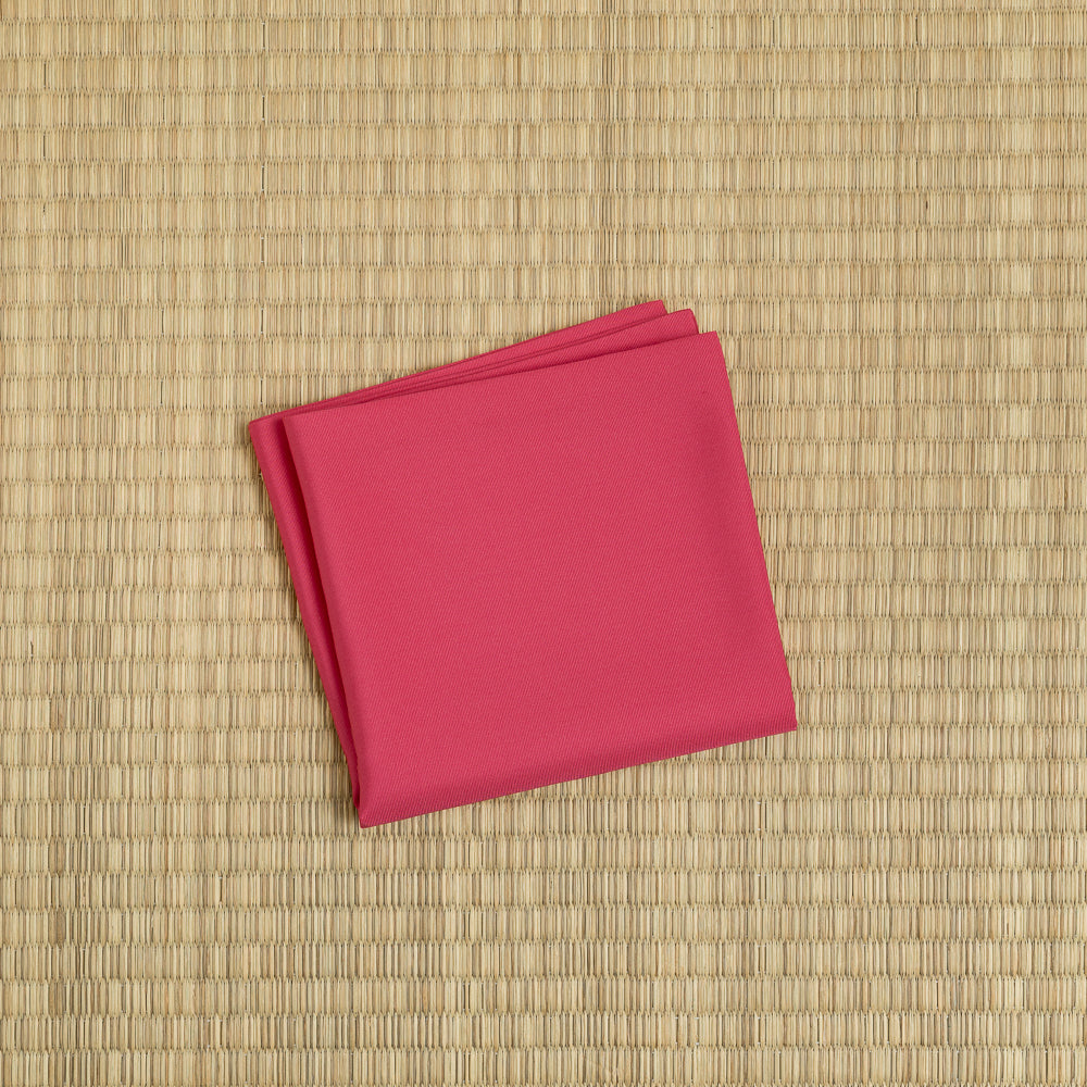 Traditional kurenai crimson red silk fukusa by Kitamura Tokusai on tatami for Chanoyu practice