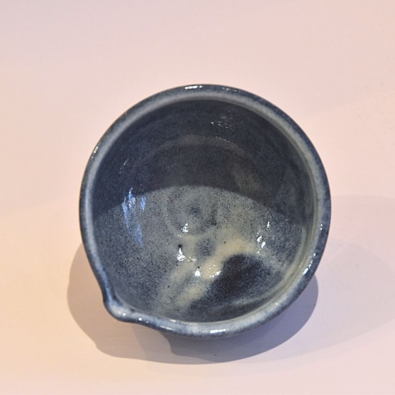 Top view of the katakuchi matcha bowl showing its dark blue-gray glazed interior and pouring lip.