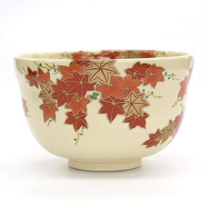 Alternate side view of the Ninsei-style matcha bowl with cascading autumn maple leaf design