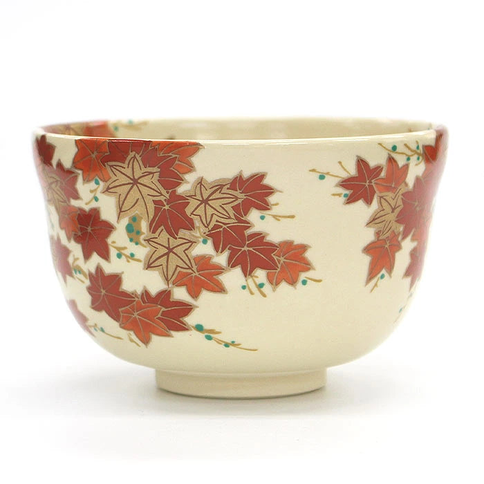 Side angle of Eika Miyaji matcha bowl showing red maple leaves and delicate decorative accents