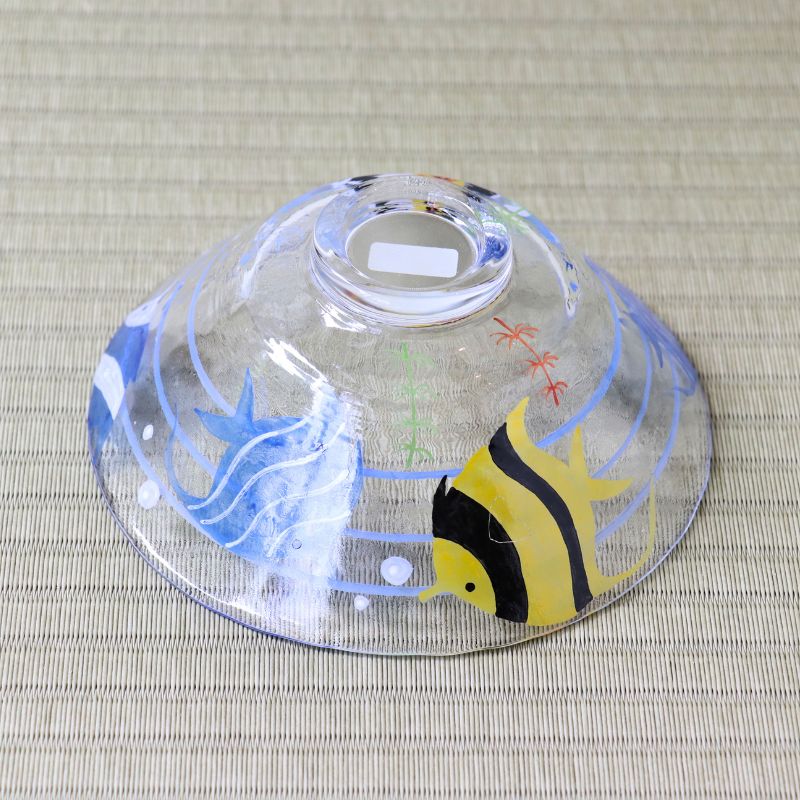 Bottom view of handcrafted glass matcha bowl showing the blue and yellow angelfish design