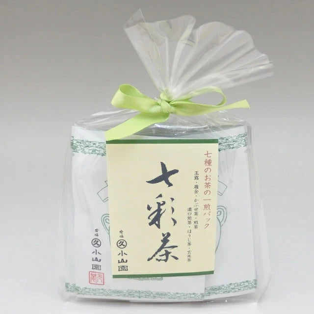 Packaged product with a green ribbon and label on a gray background