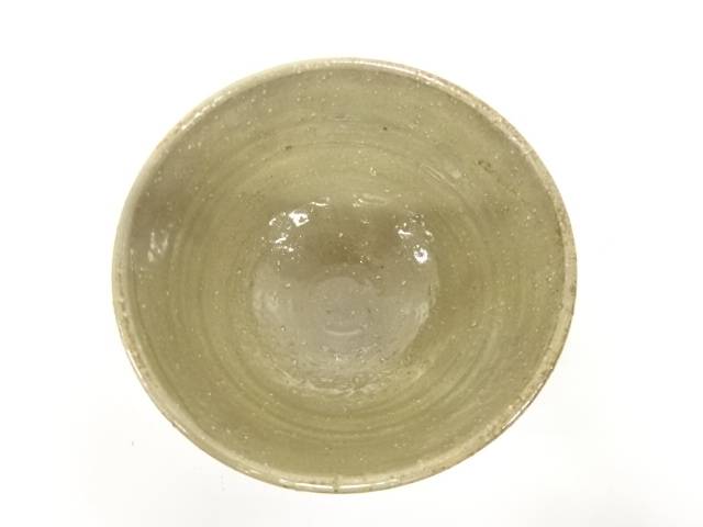 Top view of the Izumino Ware matcha bowl showing its softly glazed olive-beige interior with natural speckling and firing variation.