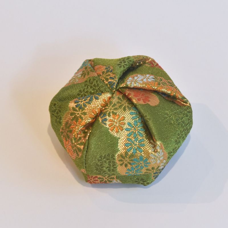 Hexagonal fabric pouch with floral pattern on a light background