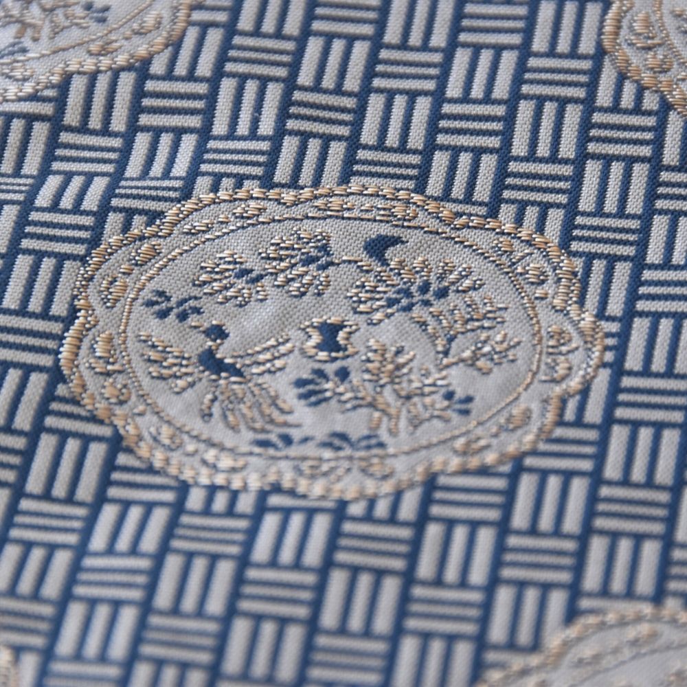 Close-up of a Japanese Nishijin silk kobukusa featuring the Kacho-monkin Futsugire pattern with phoenix and floral motifs