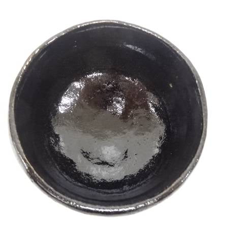 Top view of the Kawasaki Waraku Black Raku matcha bowl showing the dark glazed interior.