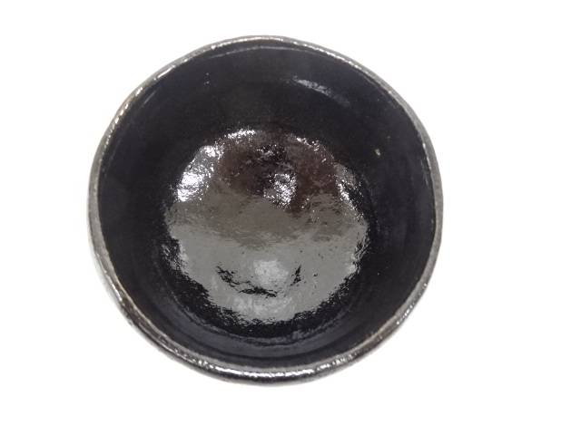 Top view of the Kawasaki Waraku Black Raku matcha bowl showing the dark glazed interior.