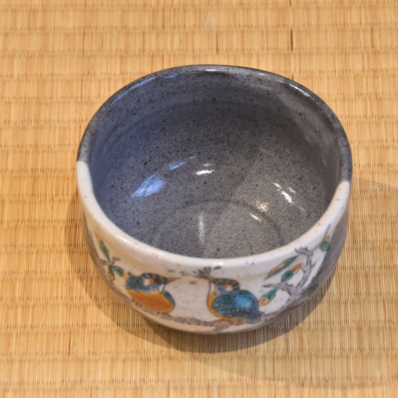 Angled top view of the Kawasemi matcha bowl showing its speckled blue-gray interior and painted kingfisher decoration around the exterior.