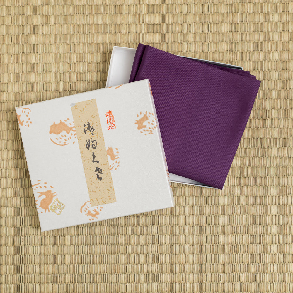Kodaimurasaki plum silk fukusa with traditional gift box displayed on tatami for Japanese tea ceremony.