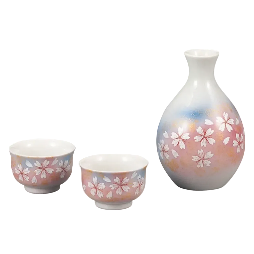 Ceramic set with two cups and a vase featuring floral patterns on a white background