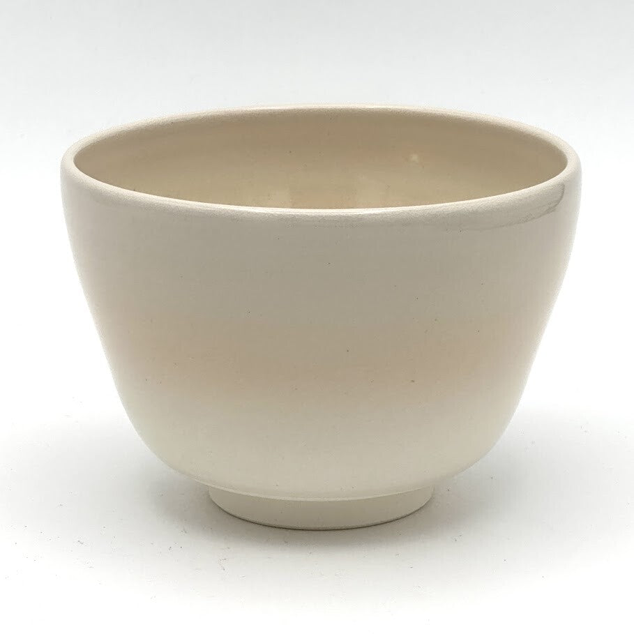 Reverse view of the Kyo-yaki Akikusa ni Usagi matcha bowl highlighting its rounded form and smooth warm ivory glazed surface