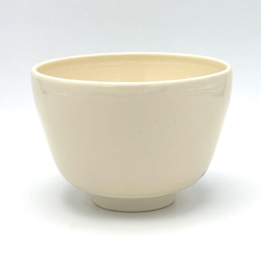 Reverse view of the Kyo-yaki Mt. Fuji matcha bowl showing its simple rounded form and warm ivory glazed surface