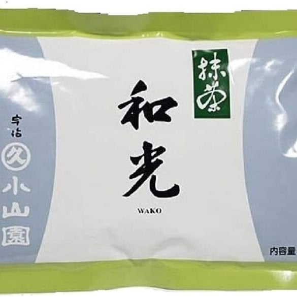 A bag of Wako Matcha by Marukyu Koyamaen with green lid, white body, and label with black Japanese characters.