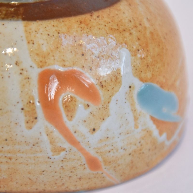 Close-up of a ceramic plate with a flamingo design on a white background